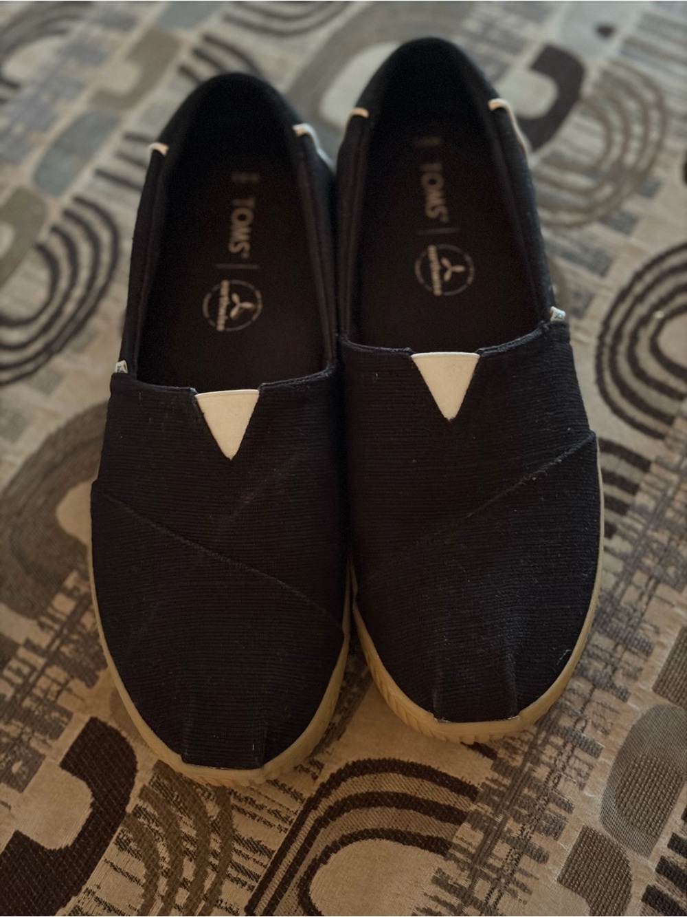 Toms Women’s Slip-On shoes in Black with White Accent